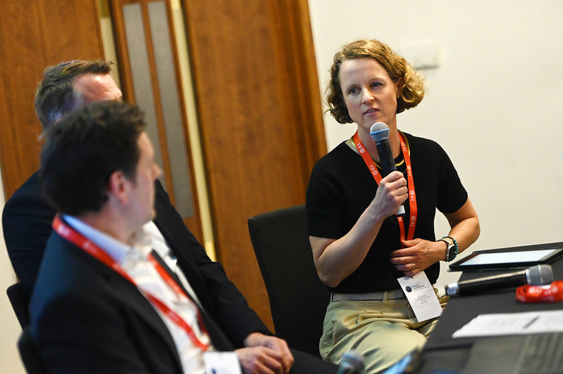 Photograph of speakers at an event.